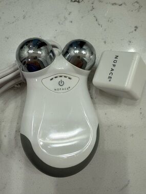 NuFace Mini Handheld Microcurrent Facial Sculpting Device in White and Silver